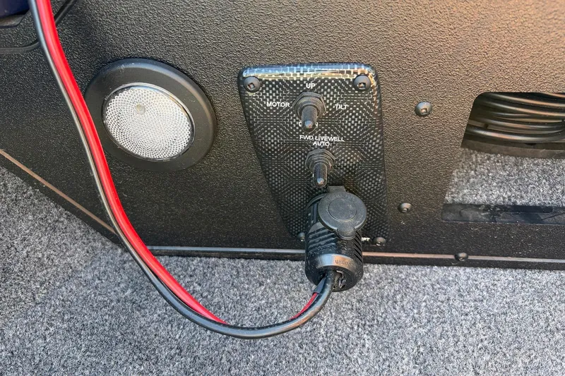 Slide: The Image of Control panel of 2024 Tracker Targa V-18 Combo boat with wiring and speaker. - 22