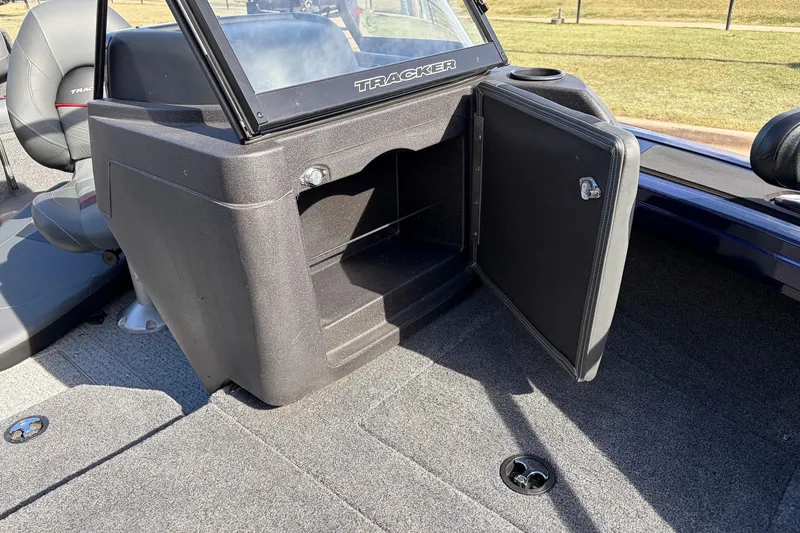 Slide: The Image of 2024 Tracker Targa V-18 Combo boat interior with open storage compartment. - 26