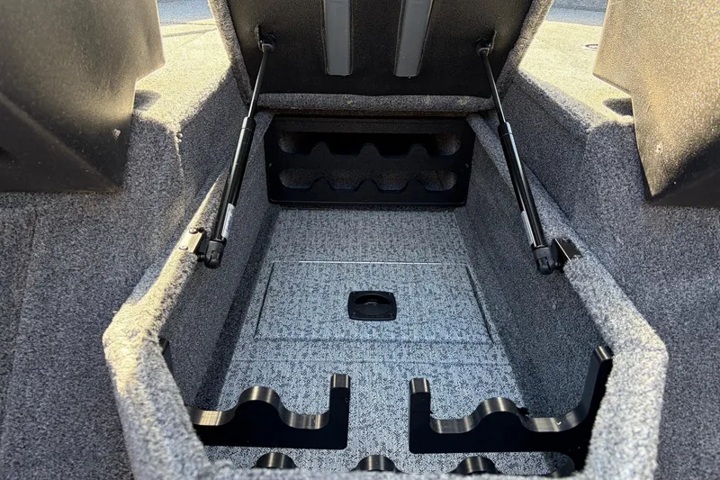 Slide: The Image of 2024 Tracker Targa V-18 Combo boat storage compartment with hydraulic lift supports. - 29