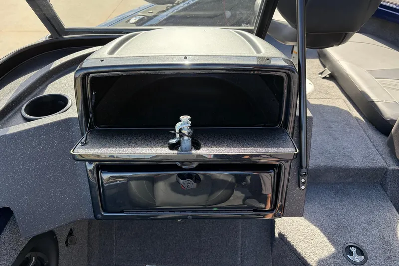 Slide: The Image of 2024 Tracker Targa V-18 Combo boat interior with open storage compartment. - 31