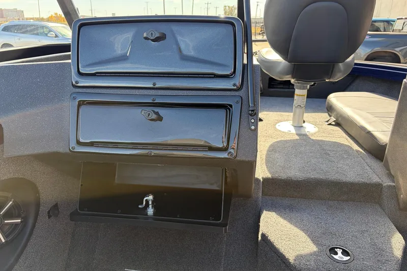 Slide: The Image of 2024 Tracker Targa V-18 Combo boat interior with storage compartments and seating. - 33