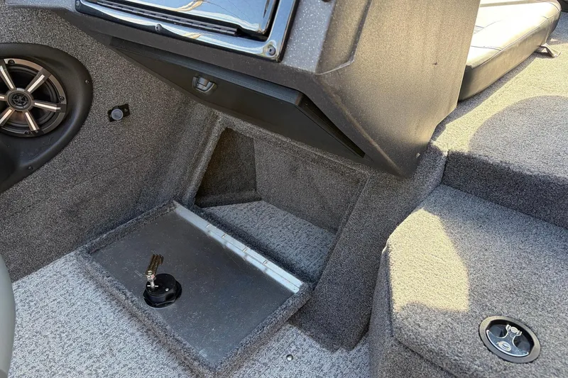 Slide: The Image of 2024 Tracker Targa V-18 Combo interior with speaker and storage compartment. - 34