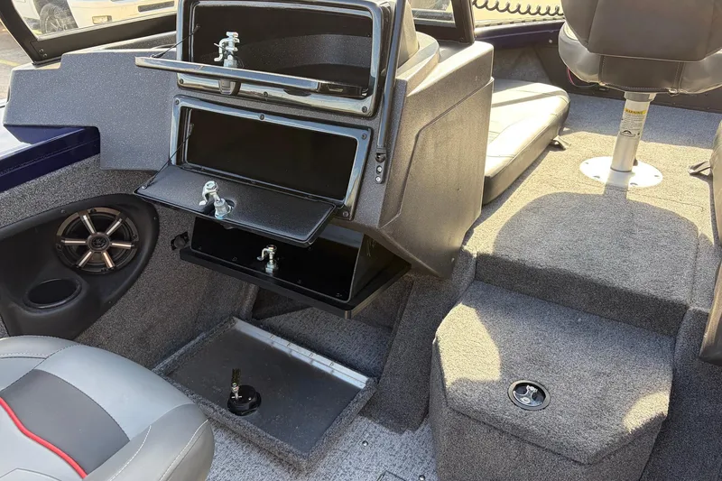 Slide: The Image of 2024 Tracker Targa V-18 Combo interior with storage compartments and seating. - 35