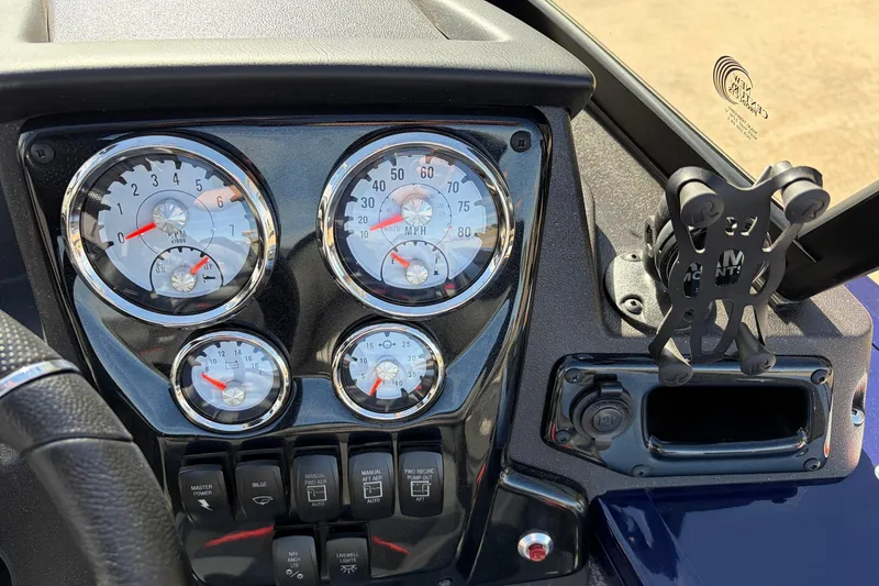 Slide: The Image of 2024 Tracker Targa V-18 Combo dashboard with gauges and controls. - 41