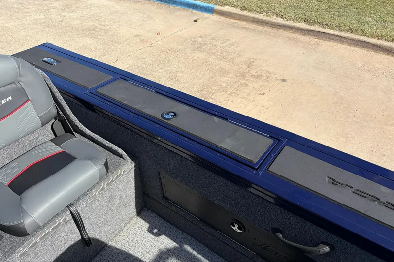 Slide: The Image of 2024 Tracker Targa V-18 Combo boat interior with seating and storage compartments. - 43