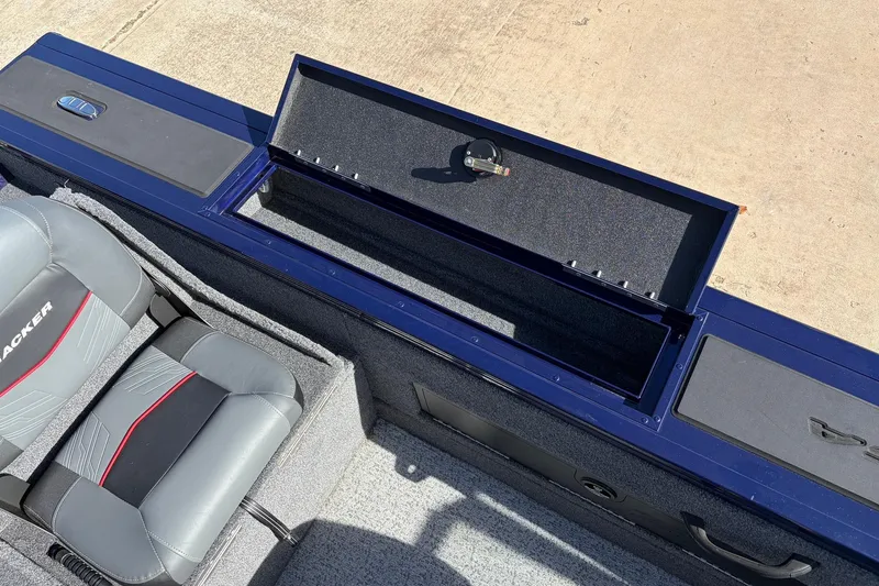 Slide: The Image of 2024 Tracker Targa V-18 Combo boat interior with storage compartment and seating. - 44