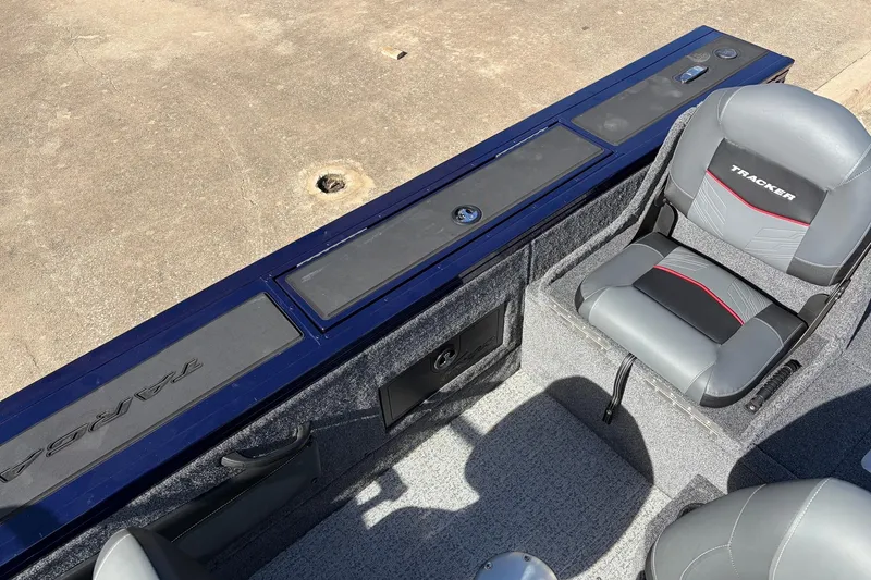 Slide: The Image of 2024 Tracker Targa V-18 Combo boat interior with seating and storage compartments. - 45