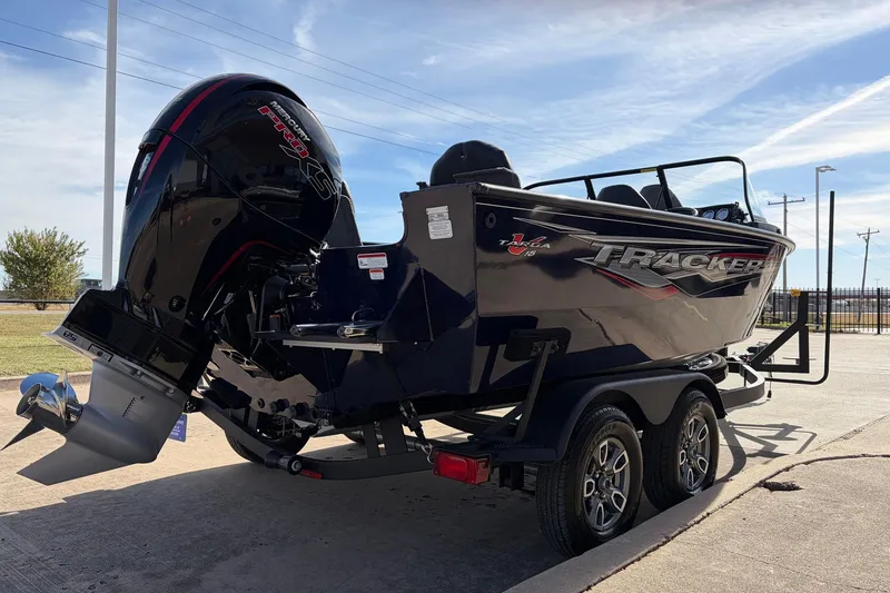 Slide: The Image of 2024 Tracker Targa V-18 Combo boat on trailer, featuring sleek design and powerful engine. - 5