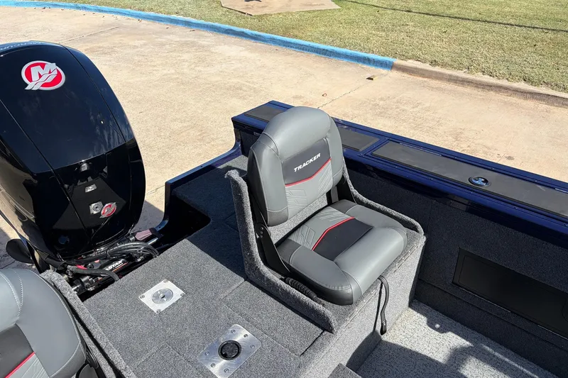 Slide: The Image of 2024 Tracker Targa V-18 Combo boat interior with seating and motor detail. - 50