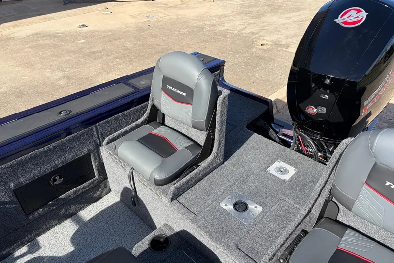 Slide: The Image of 2024 Tracker Targa V-18 Combo boat interior with seating and Mercury engine. - 51