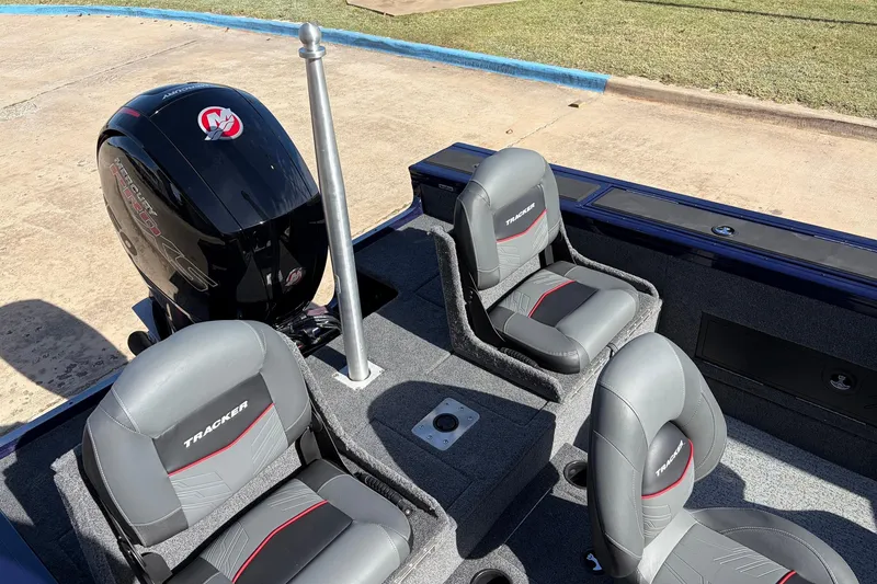 Slide: The Image of 2024 Tracker Targa V-18 Combo boat interior with seating and motor. - 62