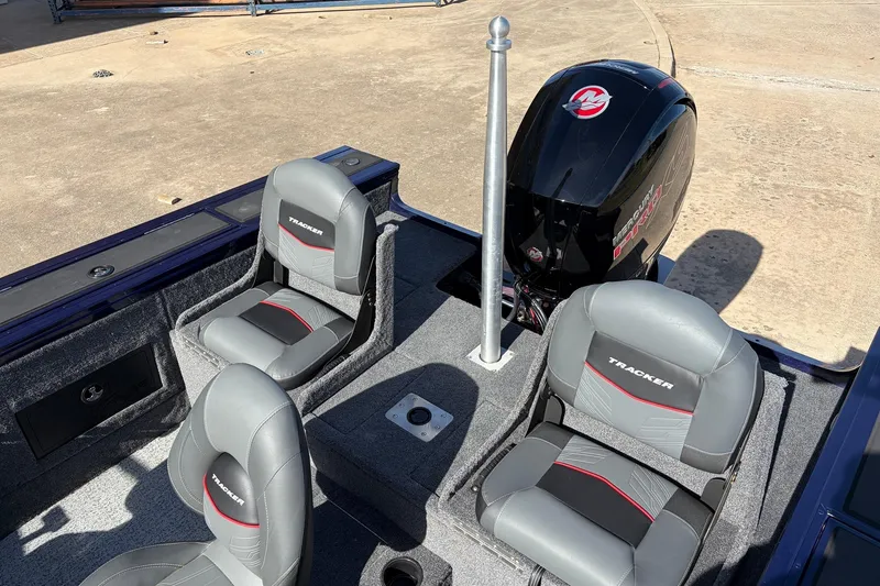 Slide: The Image of 2024 Tracker Targa V-18 Combo boat interior with seating and motor. - 63