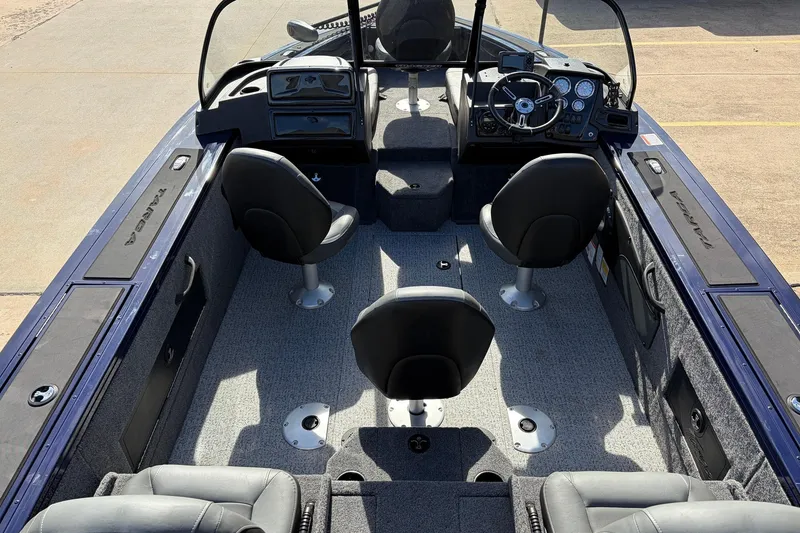 Slide: The Image of 2024 Tracker Targa V-18 Combo boat interior with seating and control panel. - 9