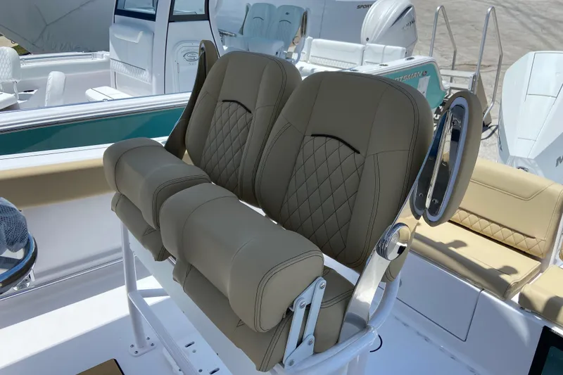 Slide: The Image of 2026 Sportsman Heritage 231 Center Console boat with luxurious seating and modern design. - 11