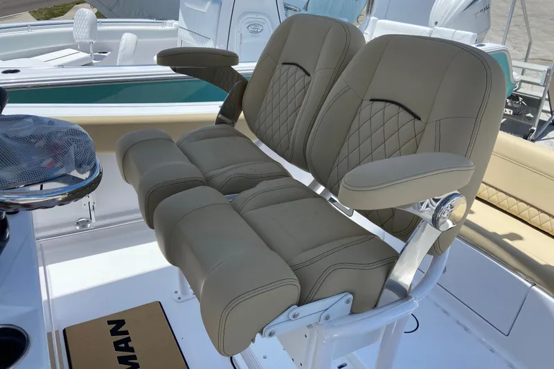 Slide: The Image of 2026 Sportsman Heritage 231 Center Console boat with luxurious seating and modern design. - 12