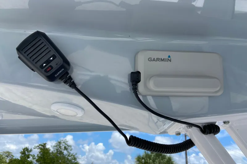 Slide: The Image of Garmin device and microphone on 2026 Sportsman Heritage 231 Center Console boat. - 13