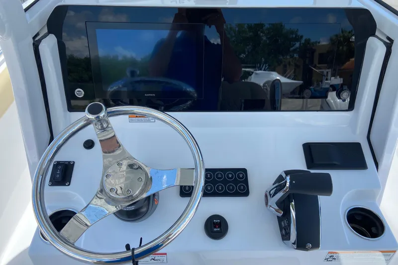 Slide: The Image of 2026 Sportsman Heritage 231 Center Console dashboard with steering wheel and controls. - 15
