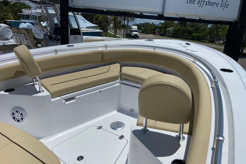 Slide: The Image of 2026 Sportsman Heritage 231 Center Console boat with beige seating and sleek design. - 25