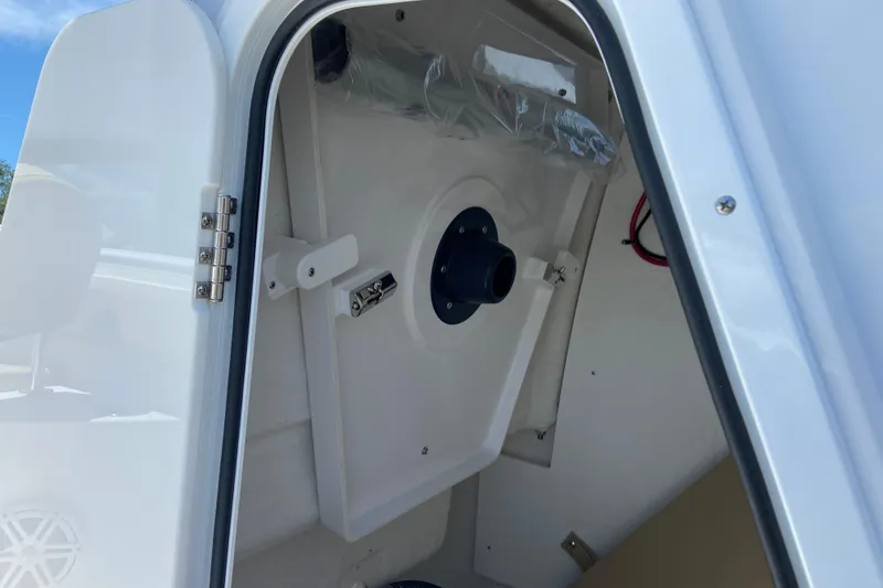 Slide: The Image of 2026 Sportsman Heritage 231 Center Console interior view with open hatch and storage compartment. - 34