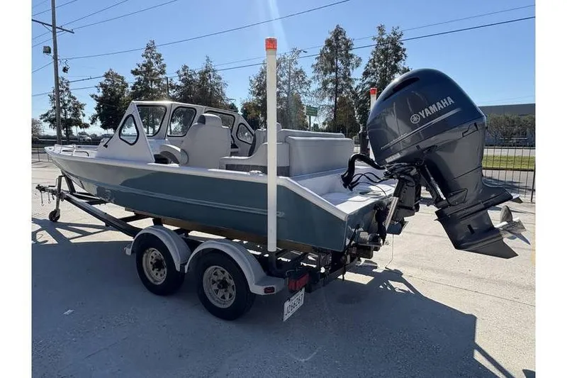 Slide: The Image of 1997 Scully's 18 WT boat on trailer with Yamaha outboard motor. - 4