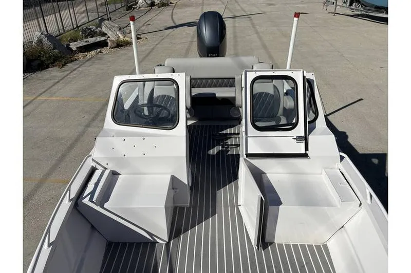 Slide: The Image of 1997 Scully's 18 WT boat interior with open cabin doors and steering wheel. - 7