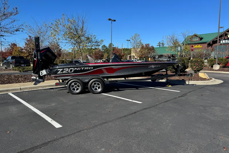 Slide: The Image of 2023 Nitro Z20 Pro boat on trailer in parking lot, sunny day. - 0