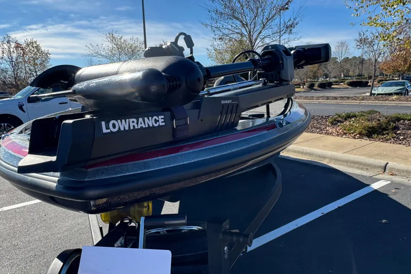 Slide: The Image of 2023 Nitro Z20 Pro boat with Lowrance Ghost trolling motor in parking lot. - 6
