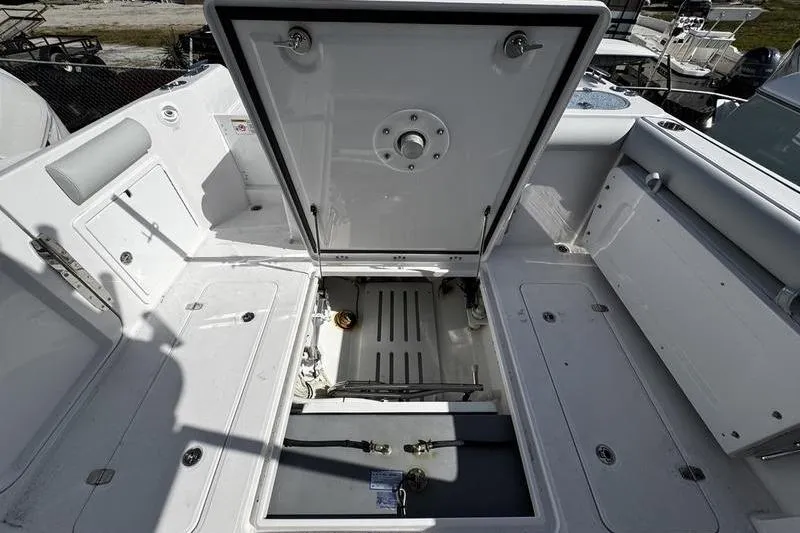 Slide: The Image of 2026 Southport 33 DC boat interior with open storage compartment. - 37