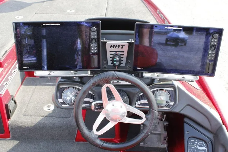 Slide: The Image of 2016 Skeeter FX20 boat dashboard with dual Humminbird Solix 12 displays and steering wheel. - 11