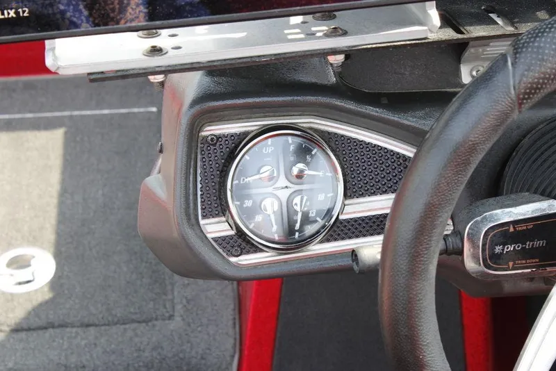 Slide: The Image of 2016 Skeeter FX20 boat dashboard with steering wheel and gauge cluster. - 15