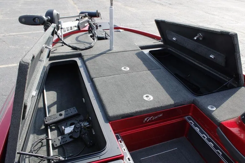 Slide: The Image of 2016 Skeeter FX20 boat interior with open storage compartments and equipment. - 23