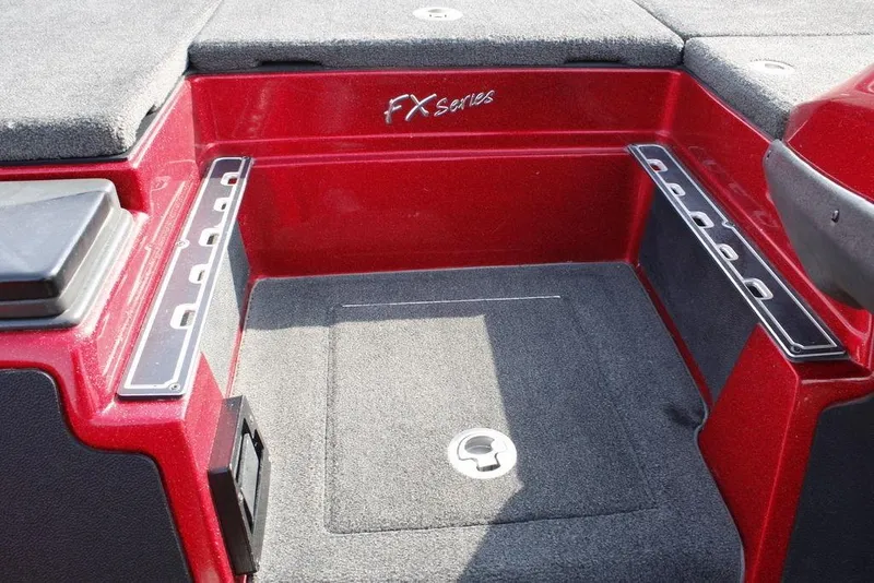 Slide: The Image of 2016 Skeeter FX20 boat interior with red and gray design, featuring storage compartments. - 26