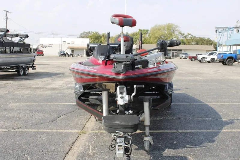 Slide: The Image of 2016 Skeeter FX20 bass boat with Minn Kota trolling motor in a parking lot. - 3