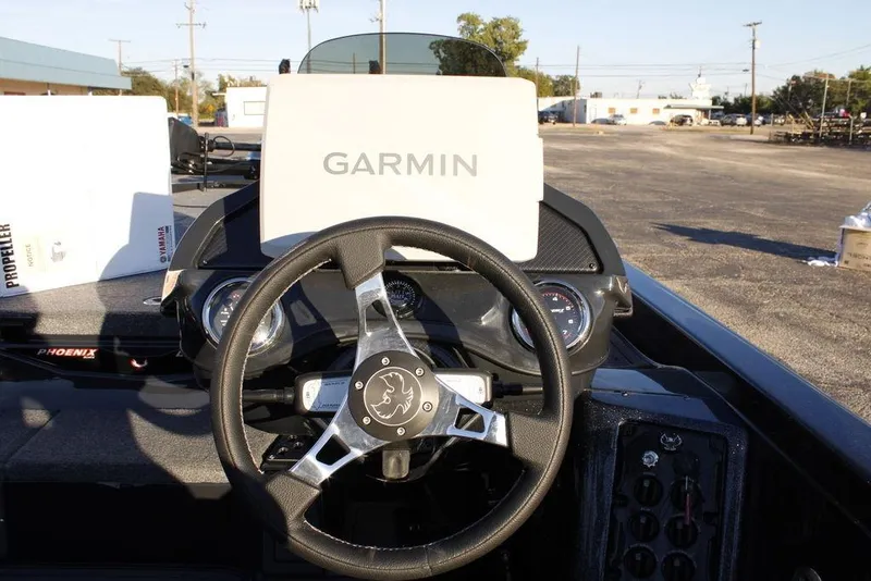 Slide: The Image of 2026 Phoenix 921 ELITE boat dashboard with Garmin navigation system and steering wheel. - 10