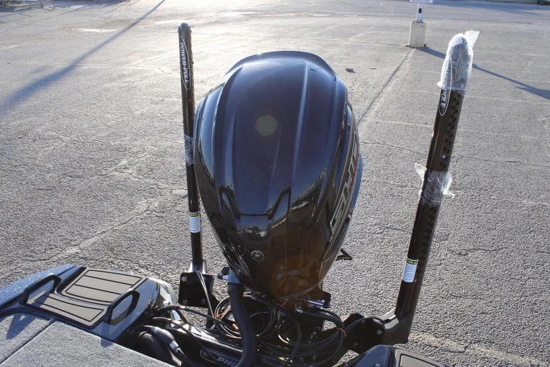 Slide: The Image of 2026 Phoenix 921 ELITE boat engine with dual power poles in a parking lot. - 16