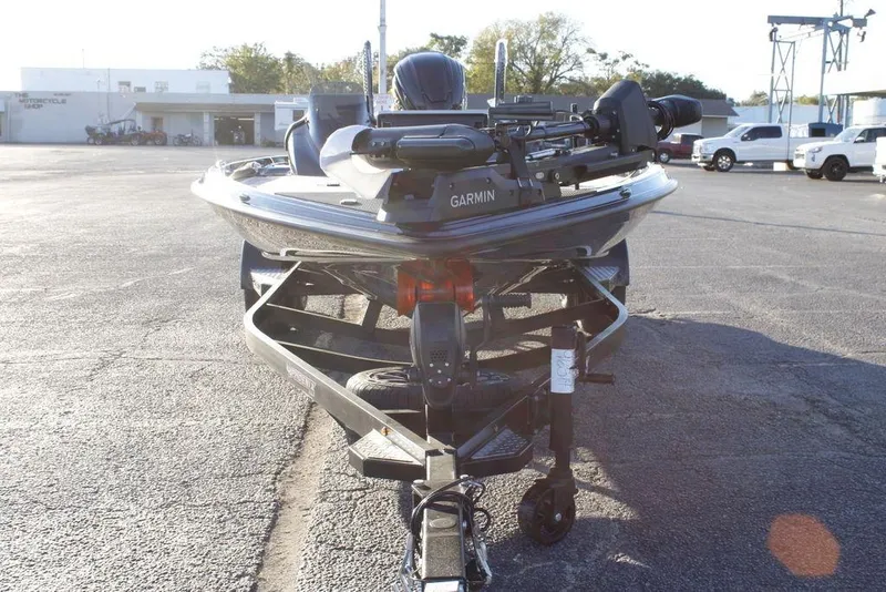 Slide: The Image of 2026 Phoenix 921 ELITE boat on trailer, equipped with Garmin technology, parked outdoors. - 17