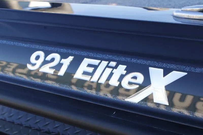 Slide: The Image of Close-up of 2026 Phoenix 921 ELITE X model emblem on a sleek surface. - 2