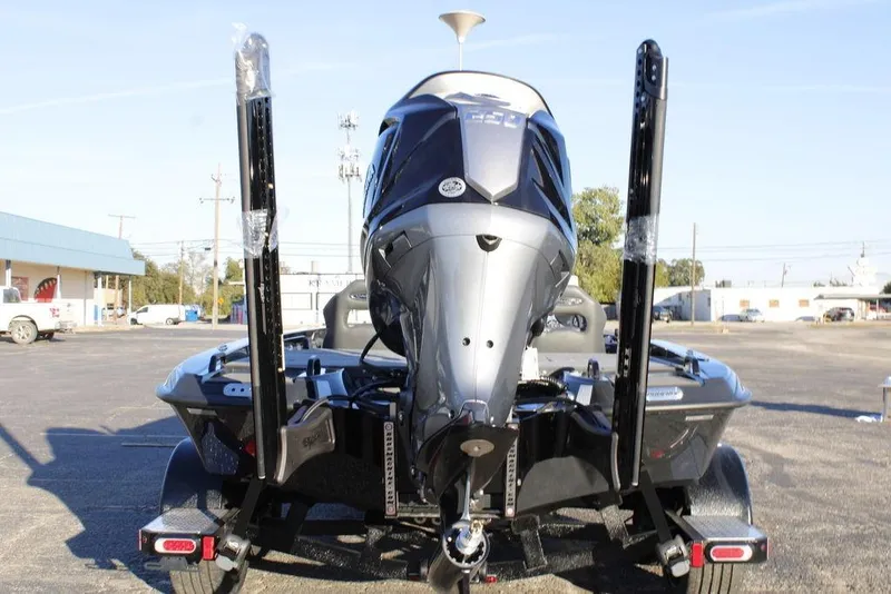 Slide: The Image of Rear view of 2026 Phoenix 921 ELITE boat on trailer in parking lot. - 4