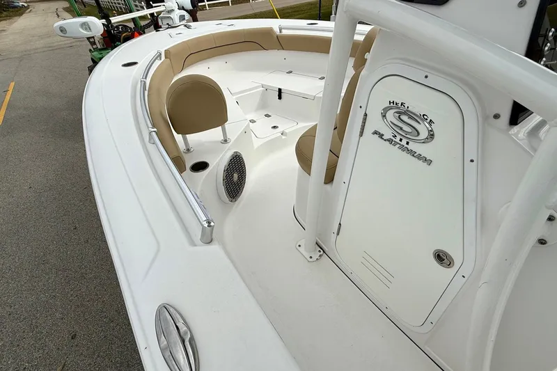 Slide: The Image of 2019 Sportsman Heritage 211 Center Console boat interior with seating and storage. - 12