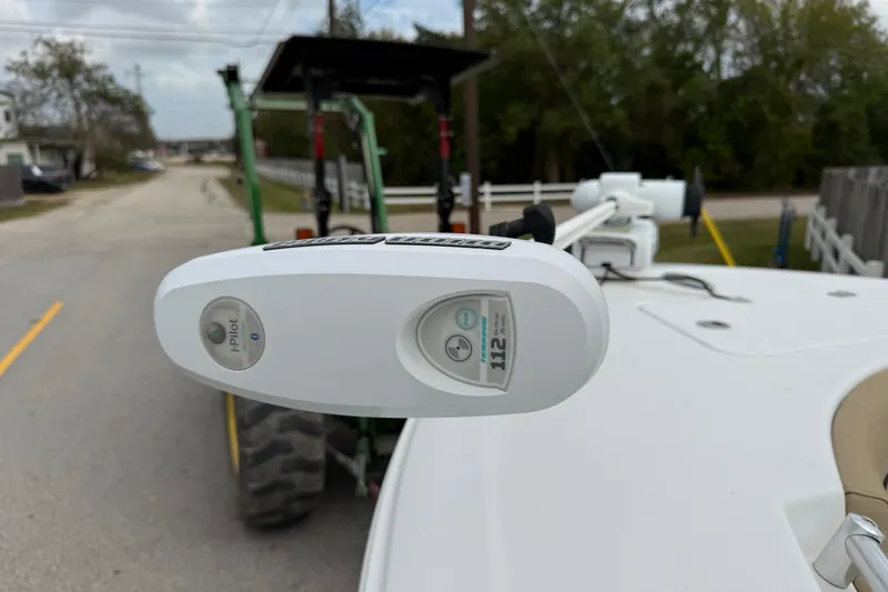 Slide: The Image of 2019 Sportsman Heritage 211 Center Console with i-Pilot trolling motor on a road. - 17