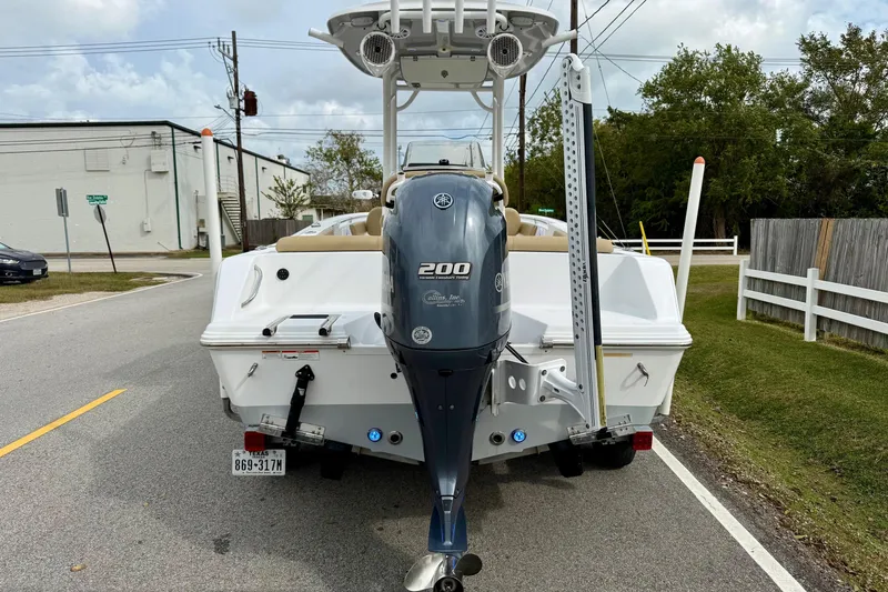 Slide: The Image of 2019 Sportsman Heritage 211 Center Console boat with Yamaha 200 engine on a street. - 3