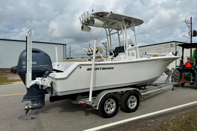 Slide: The Image of 2019 Sportsman Heritage 211 Center Console boat on trailer, featuring Yamaha outboard motor. - 4