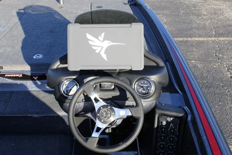 Slide: The Image of Steering console of 2026 Phoenix 721 boat with modern dashboard design. - 12