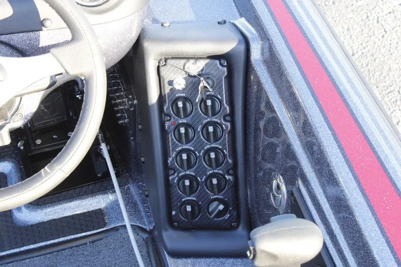 Slide: The Image of 2026 Phoenix 721 boat dashboard with control panel and steering wheel. - 13