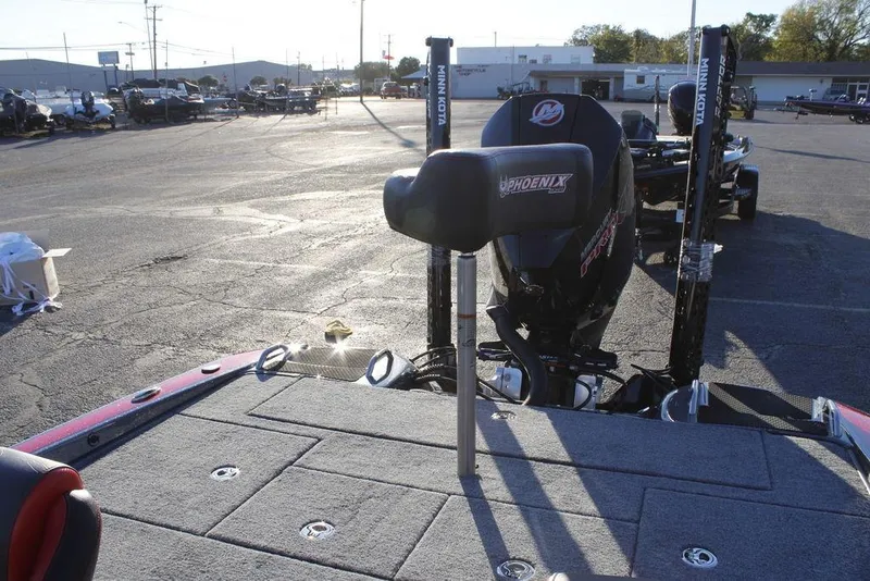 Slide: The Image of 2026 Phoenix 721 boat in parking lot, featuring motor and deck details. - 17