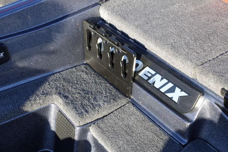 Slide: The Image of 2026 Phoenix 721 boat interior with rod holder and textured flooring. - 23