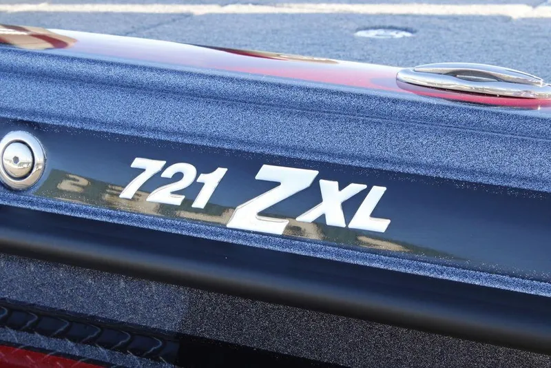 Slide: The Image of Close-up of 2026 Phoenix 721 ZXL boat model emblem on metallic surface. - 5