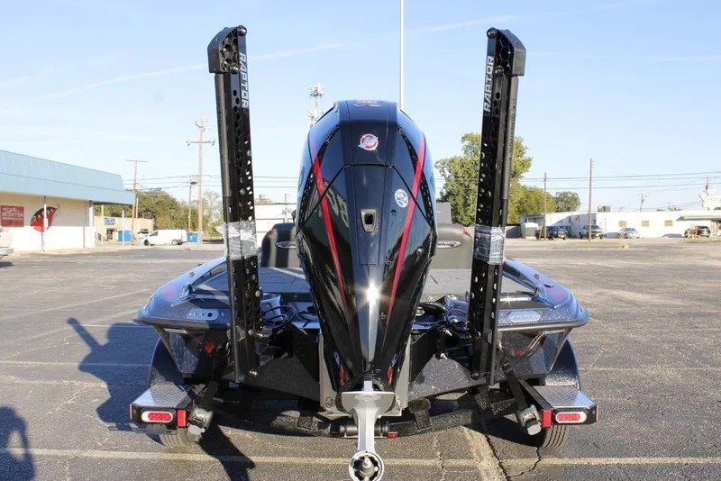 Slide: The Image of 2026 Phoenix 721 boat with powerful outboard motor in a parking lot. - 8