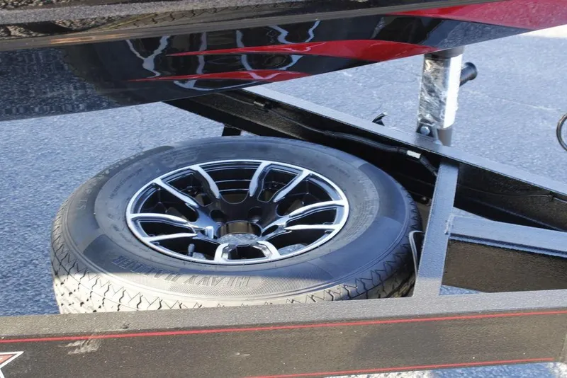 Slide: The Image of Spare tire on a 2026 Phoenix 721 boat trailer, featuring sleek alloy wheel design. - 9