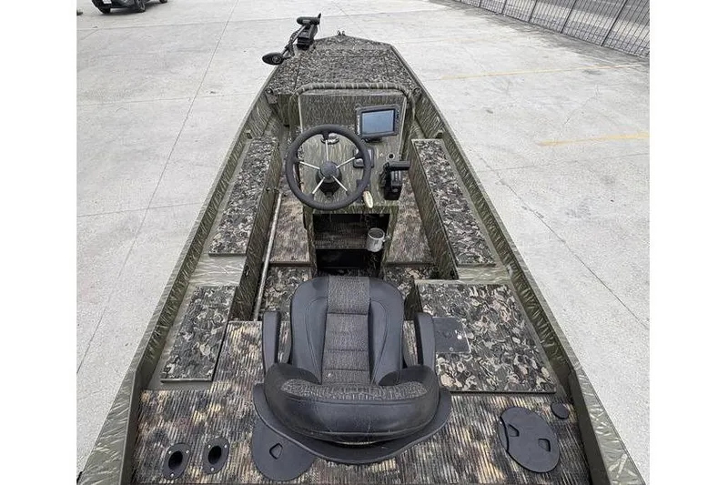 Slide: The Image of 2013 Gator Trax 17X54 boat interior with camouflage design and steering console. - 6